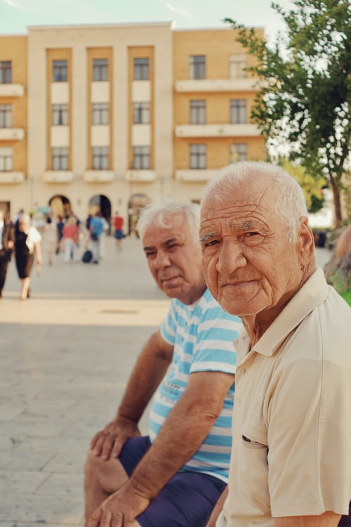 This image shows 2 old men who are kept in care homes and are not much happy with the care they are provided.